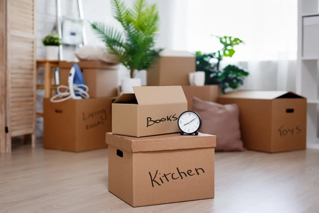 moving-day-concept-cardboard-boxes-with-belongings-prepared-moving-into-new-house